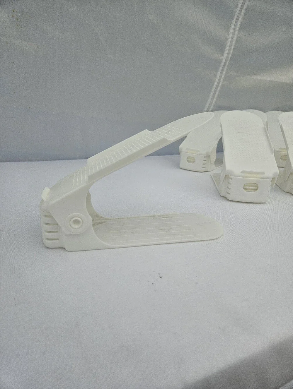 12 White plastic shoe organizers for closets